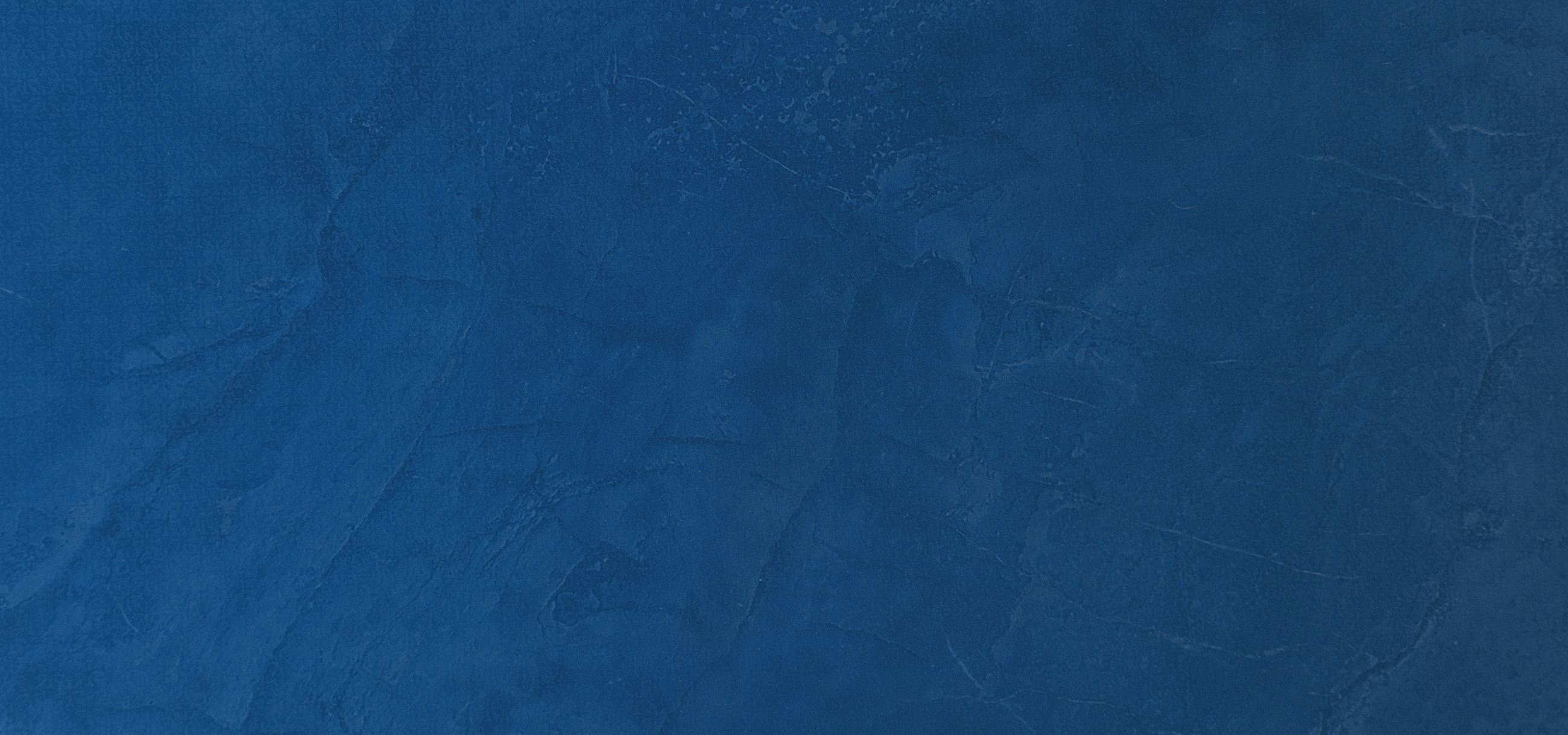 Textured deep blue background with subtle variations.