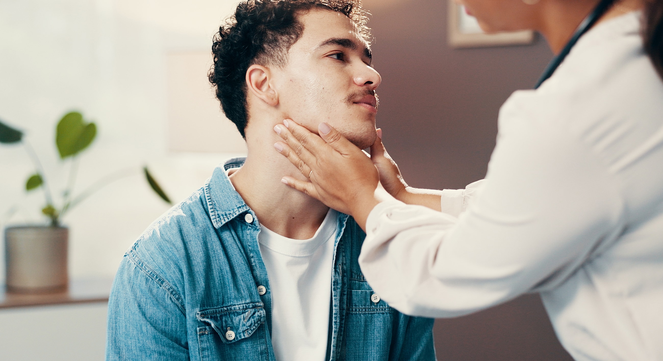 Person receiving a facial examination in clinic setting.