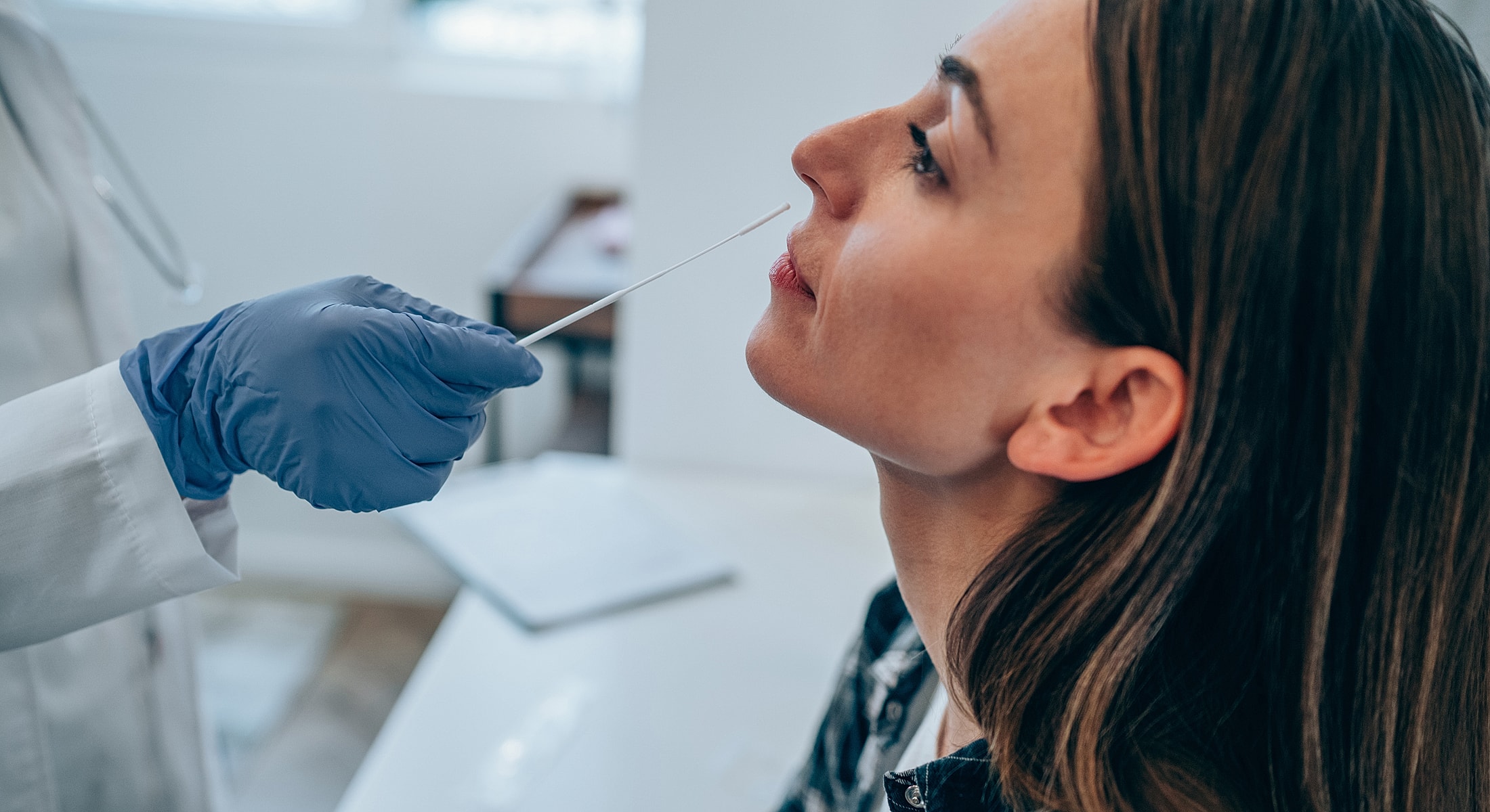 Patient receiving skincare treatment in clinic.
