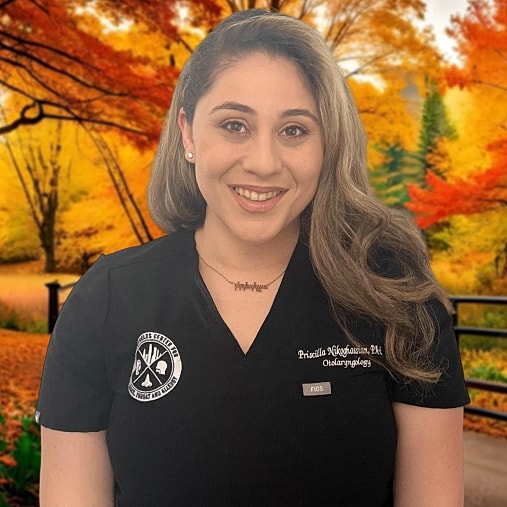 Female healthcare professional in autumn setting.