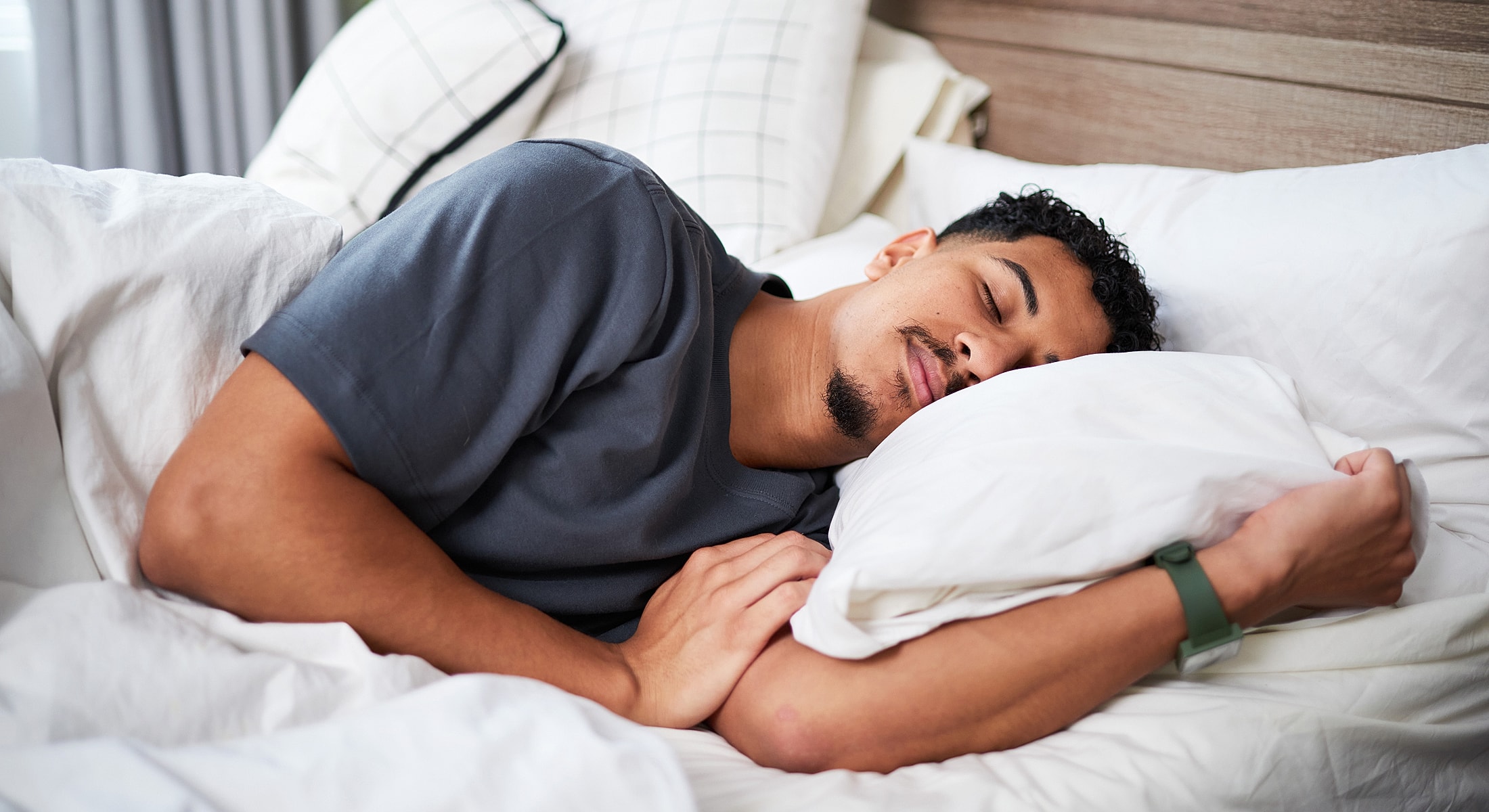 Doctor examining older woman's neck in clinic.