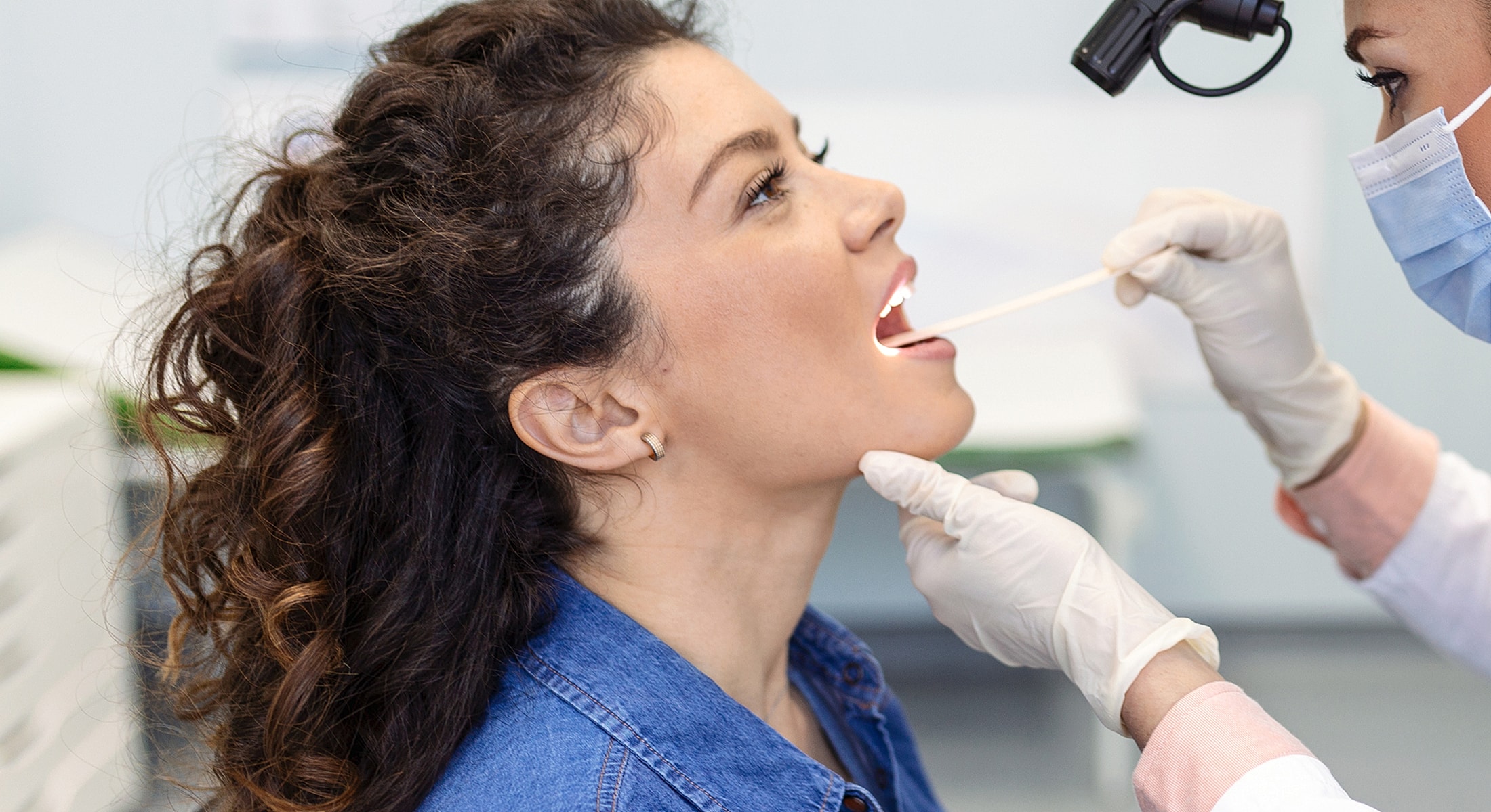 Dental examination with patient and dentist interaction.