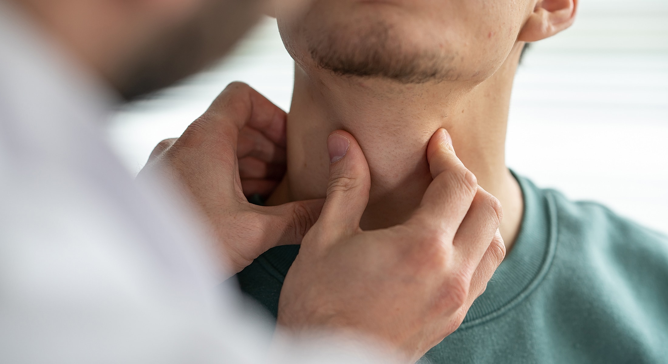 Examining a person's neck for medical reasons