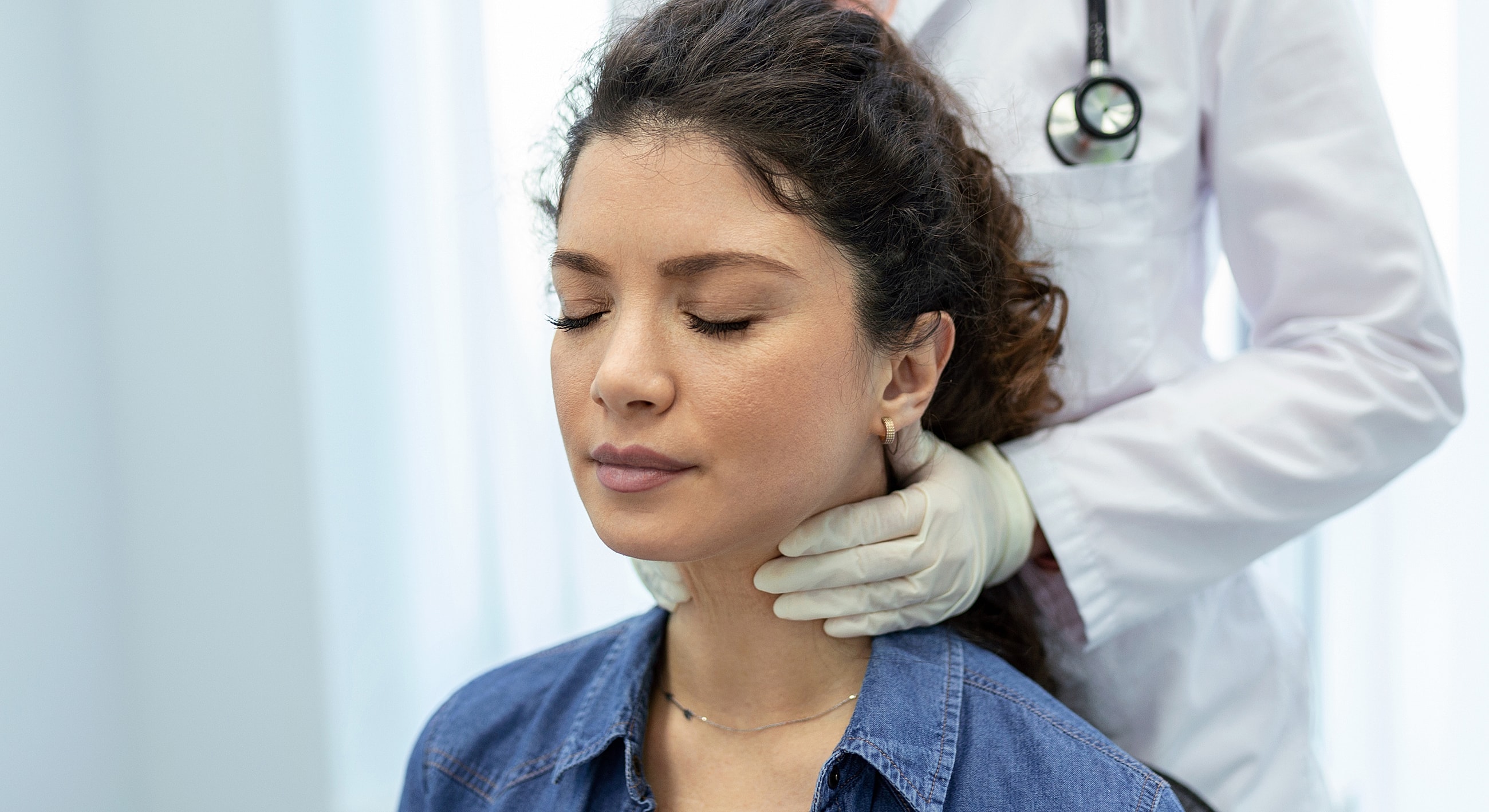 Medical examination of a woman by healthcare professional.